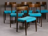 six chairs with teal upholstered seats in a row