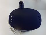 a blue object on a white surface with a cord