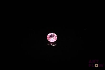 the pink moon shines brightly in the dark sky above the water