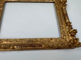 a picture of a gold picture frame on the wall