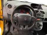 dashboard of a small car with a steering wheel and dashboard controls