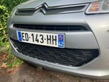 a silver car parked on the side of the road