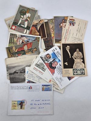 a pile of old postcards on a white table