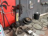an image of a garage with a lot of tools on the floor