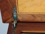 a close up of a wooden cabinet with a glass door