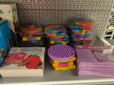 a lot of toys on the shelf in the store