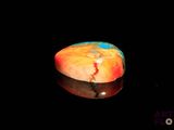 an image of a piece of cake on a black surface