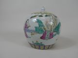 a white vase with a painting on it sitting on a table