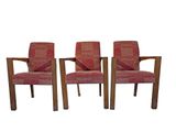 set of four mid century style chairs with red upholstered upholstered cushions