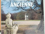 the cover of a book with a statue of a woman sitting on a bench
