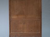an image of a wooden cabinet with a shelf on the top