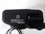 a close up of a camera with a cord attached to it