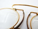 a pair of glasses sitting on top of a table
