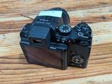 a camera that is sitting on a wooden table