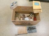 a box with a bunch of items in it on the floor