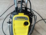 yellow and black pressurer sitting on the floor in a room