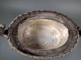 a silver bowl that is sitting on a table