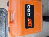an orange case sitting on the floor next to other items
