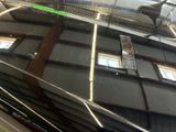 a reflection of a building on the windshield of a car