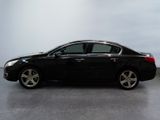 a picture of a black car that is parked in a garage