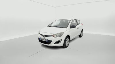 a white car is parked in a white room