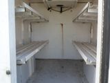 a small room that has a lot of shelves in it