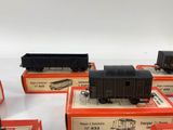 six train cars sitting on top of each other on a table