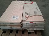 several stacks of wooden planks stacked on a pallet in a warehouse
