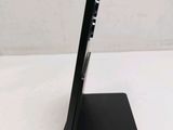 the back of a tablet computer sitting on top of a black stand