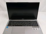 an open laptop computer sitting on top of a white surface