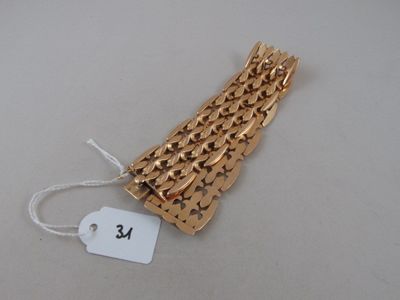 a gold bracelet with a tag attached to it