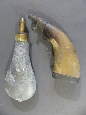 two old light bulbs on a table next to a water faucet