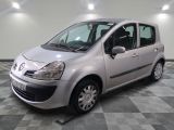 a picture of a small silver car parked in a garage