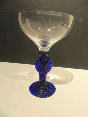 a wine glass that is sitting on a table
