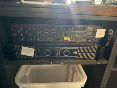 a radio that is sitting on top of a trash can