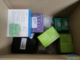 a cardboard box with various electronic items in it