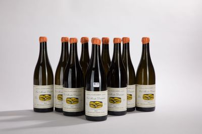 six bottles of wine are lined up in a row