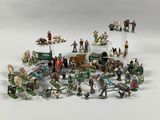 a lot of figurines that are sitting on a table