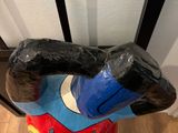 a statue of a man that is sitting on a chair