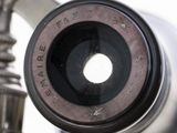 a close up view of a camera lens on a tripod