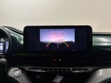 a picture of a car dashboard with a monitor on it