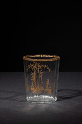 an image of a glass cup with a picture of a man and a woman on it