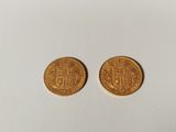 two gold coins, one of which is a sovereign and the other of which is a sovereign