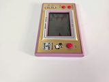 a pink and yellow gameboy sitting on a white surface