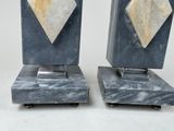 pair of art deco marble bookends on casteors on a white background