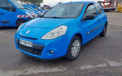 a blue car that is parked in a parking lot