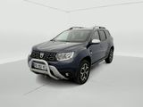 a blue dacia is parked in a white room