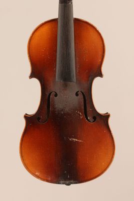 an old violin with a bow hanging from it ' s neck