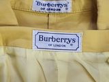 a close up of a yellow jacket with a label on it