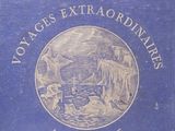 an old blue book with a picture of a boat on it